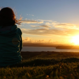 Clairvoyant-image1 a clairvoyant looking over a sunset whilst stood in a field