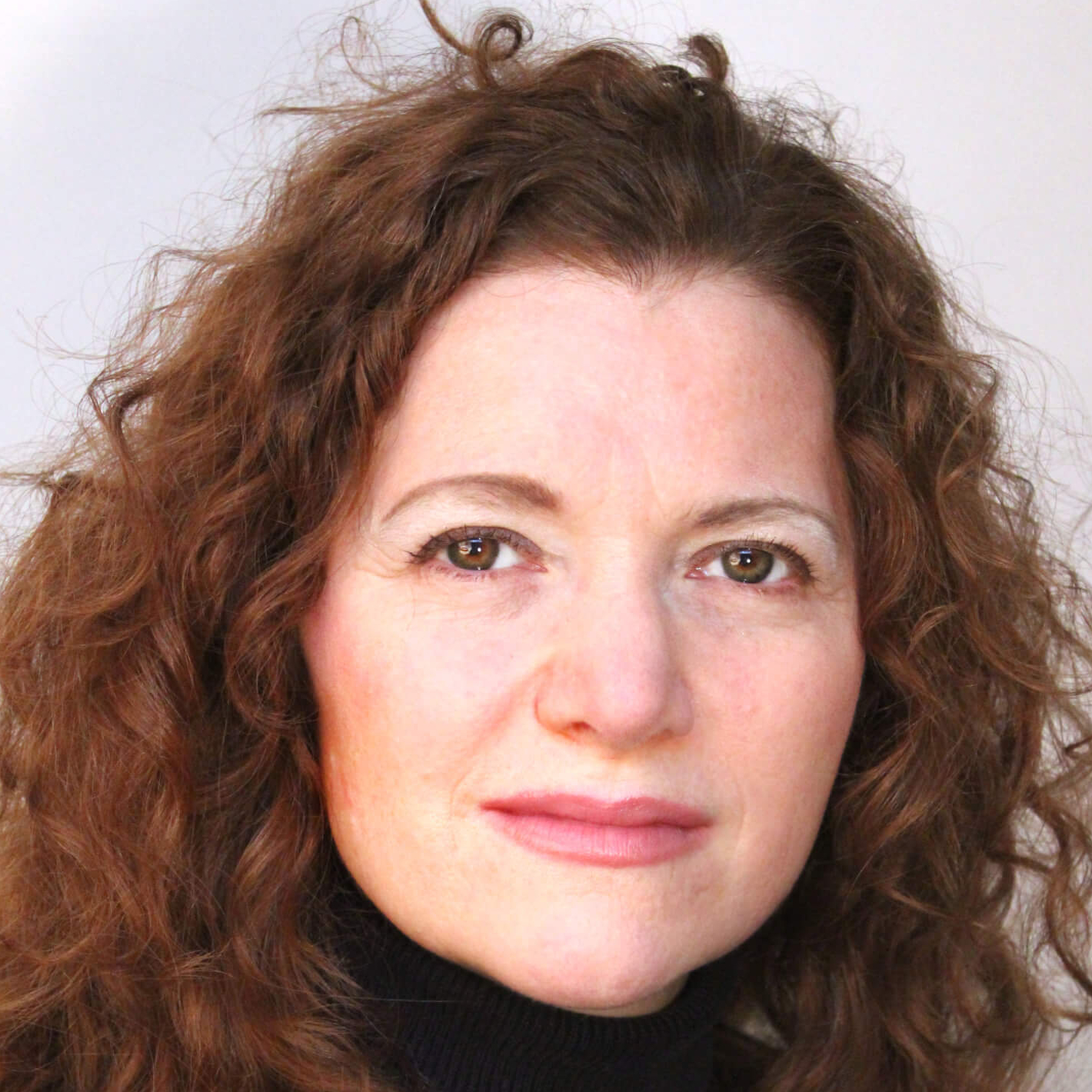 A close up of a woman smiling