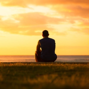 Psychic-image1 a psychic sat down, deep in thought, starring into the sunset.