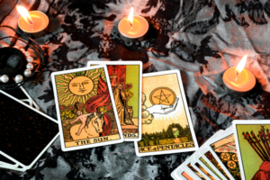 Tarot cards laid out next to a candle